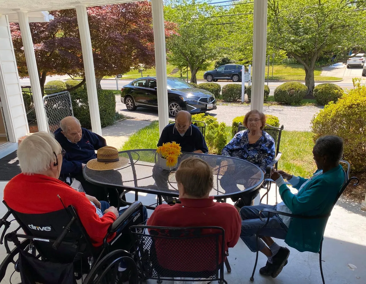 Residents enjoying time together on the front porch